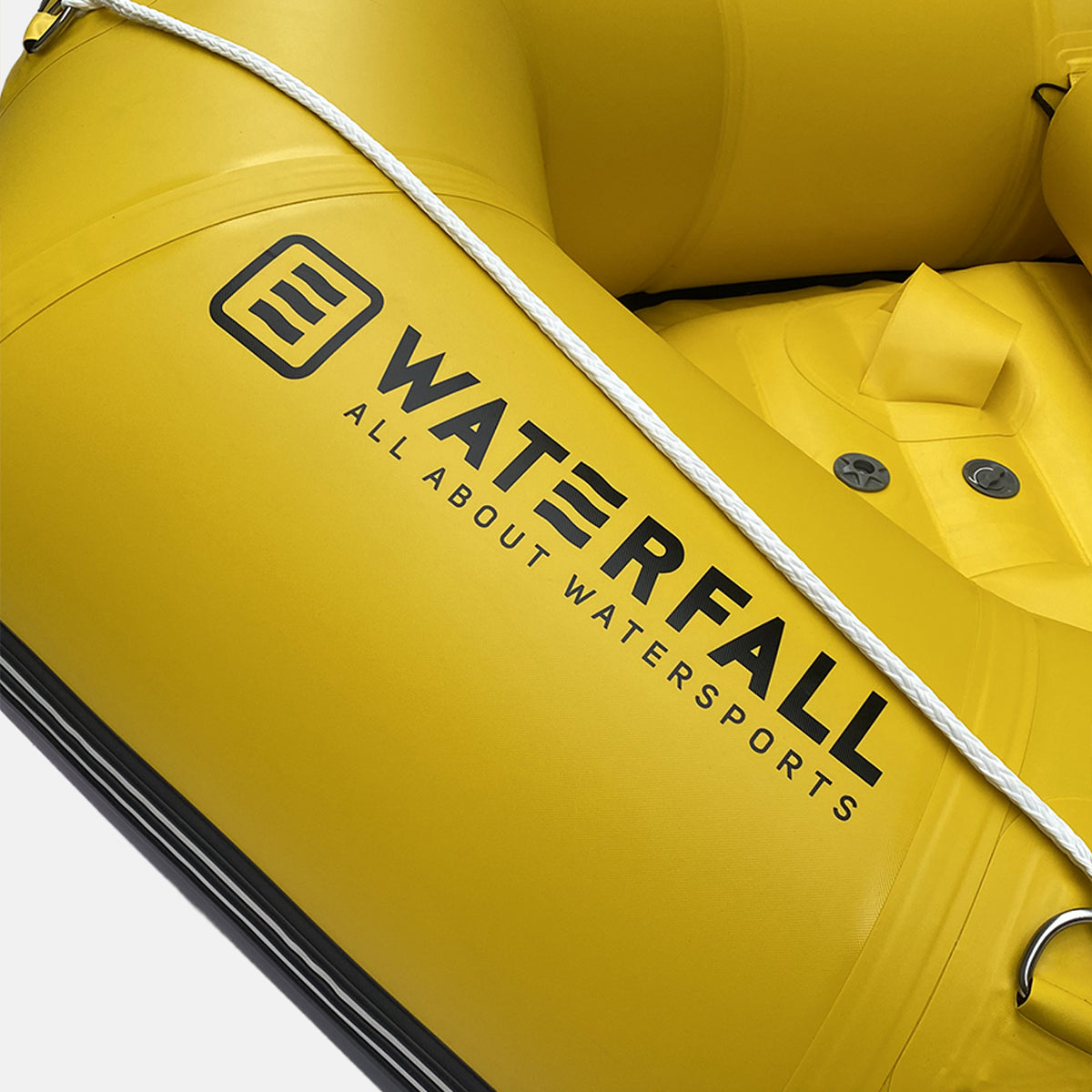 Yellow inflatable sports raft with white rope and black trim; WATERFALL branding on side