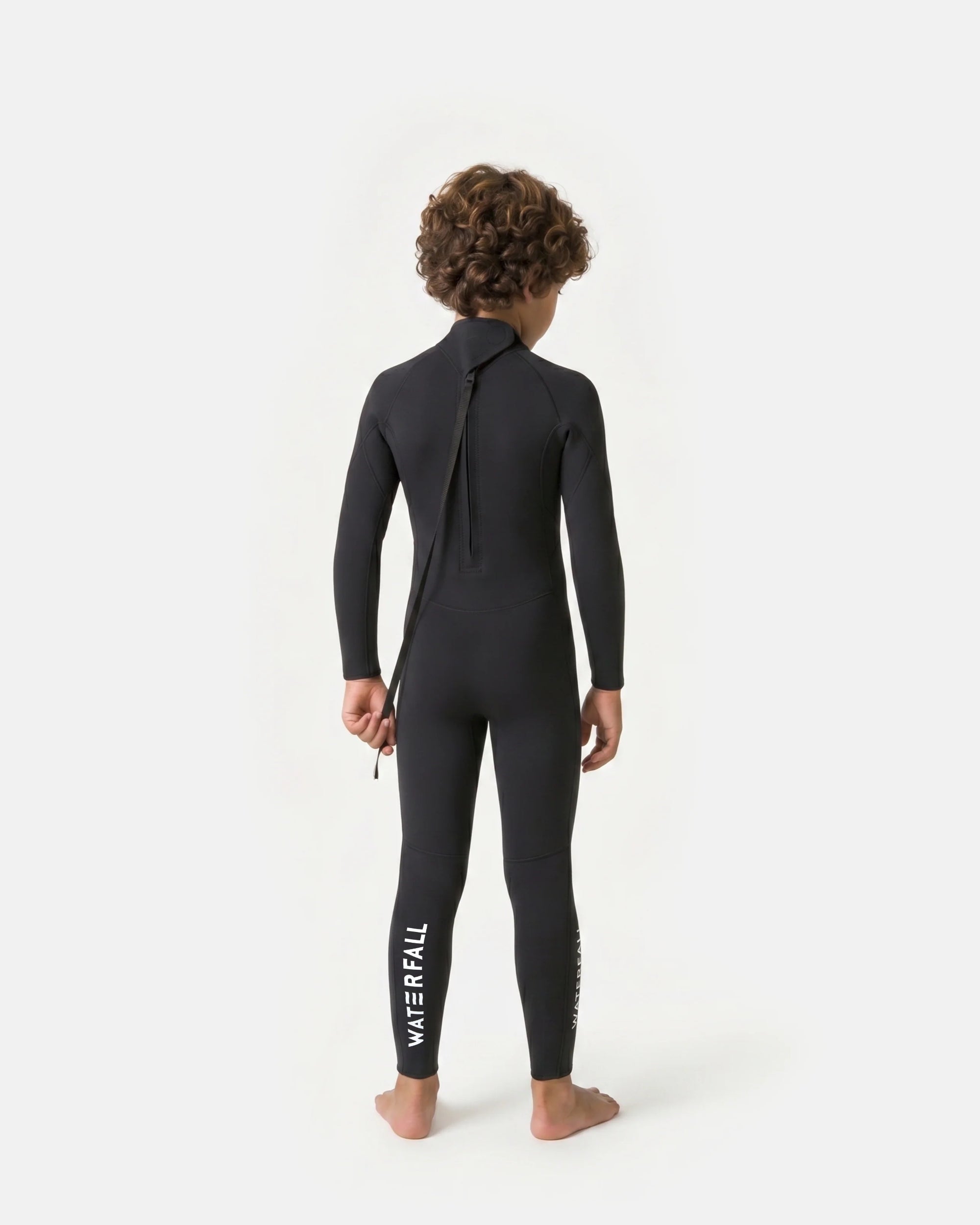 Kids black wetsuit back view with back zipper and WATERFALL logo on leg
