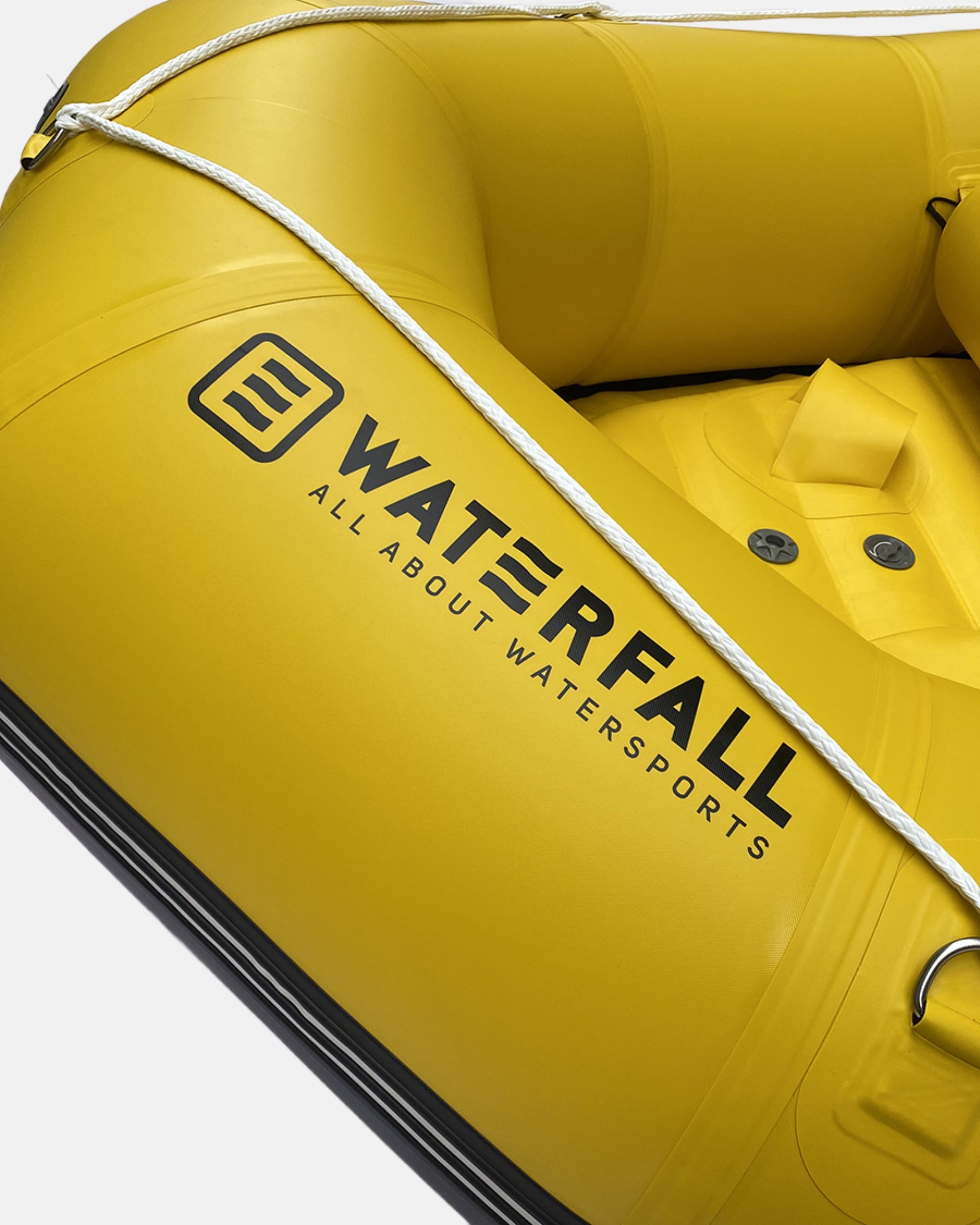 Yellow inflatable raft seat area with side carry handles and safety grab straps