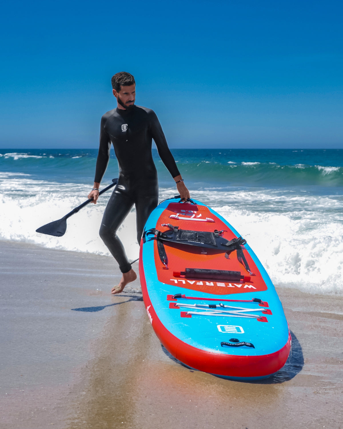 Inflatable SUP paddleboard, blue and red with carry handle and deck pad