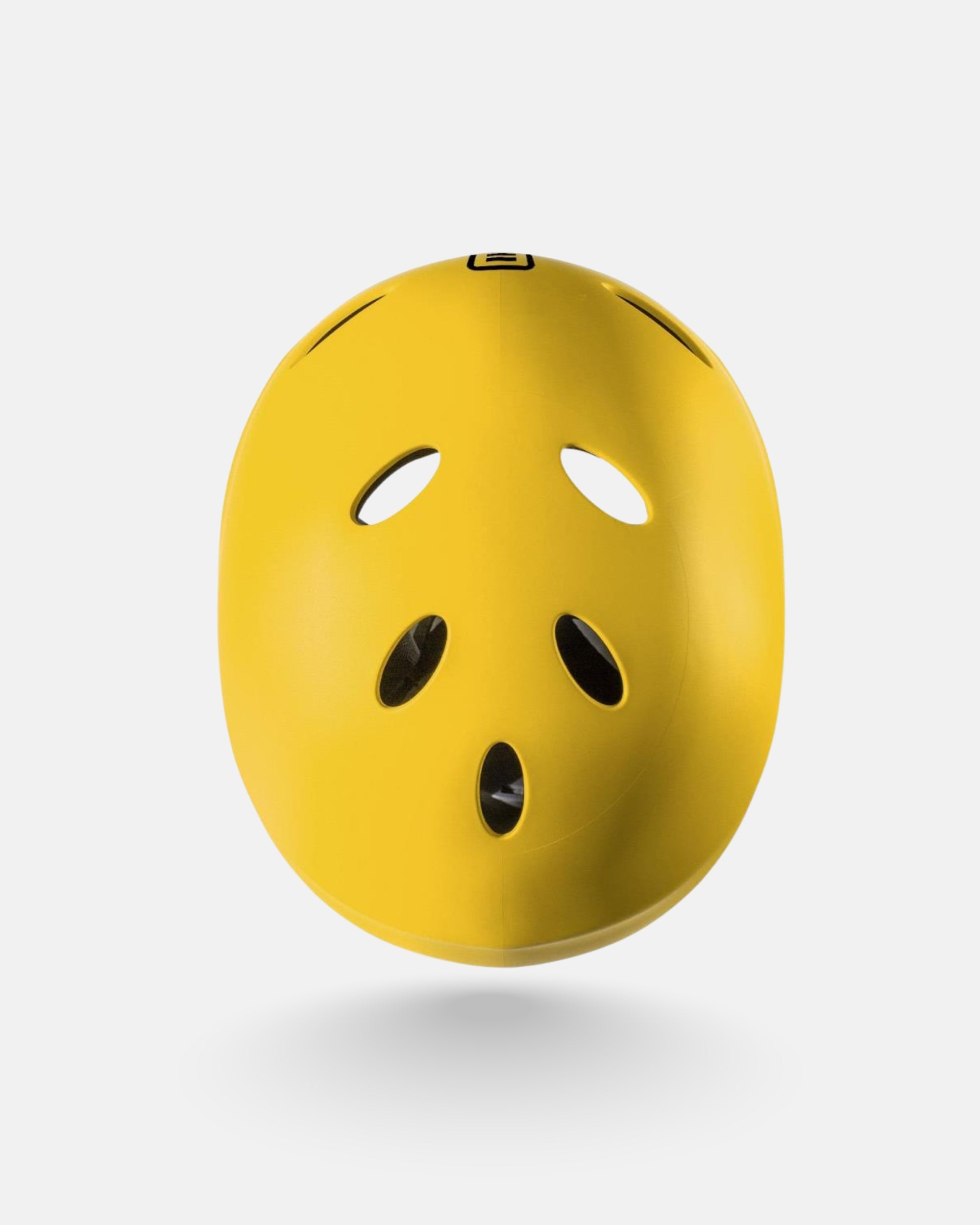 Yellow helmet shell with oval ventilation holes