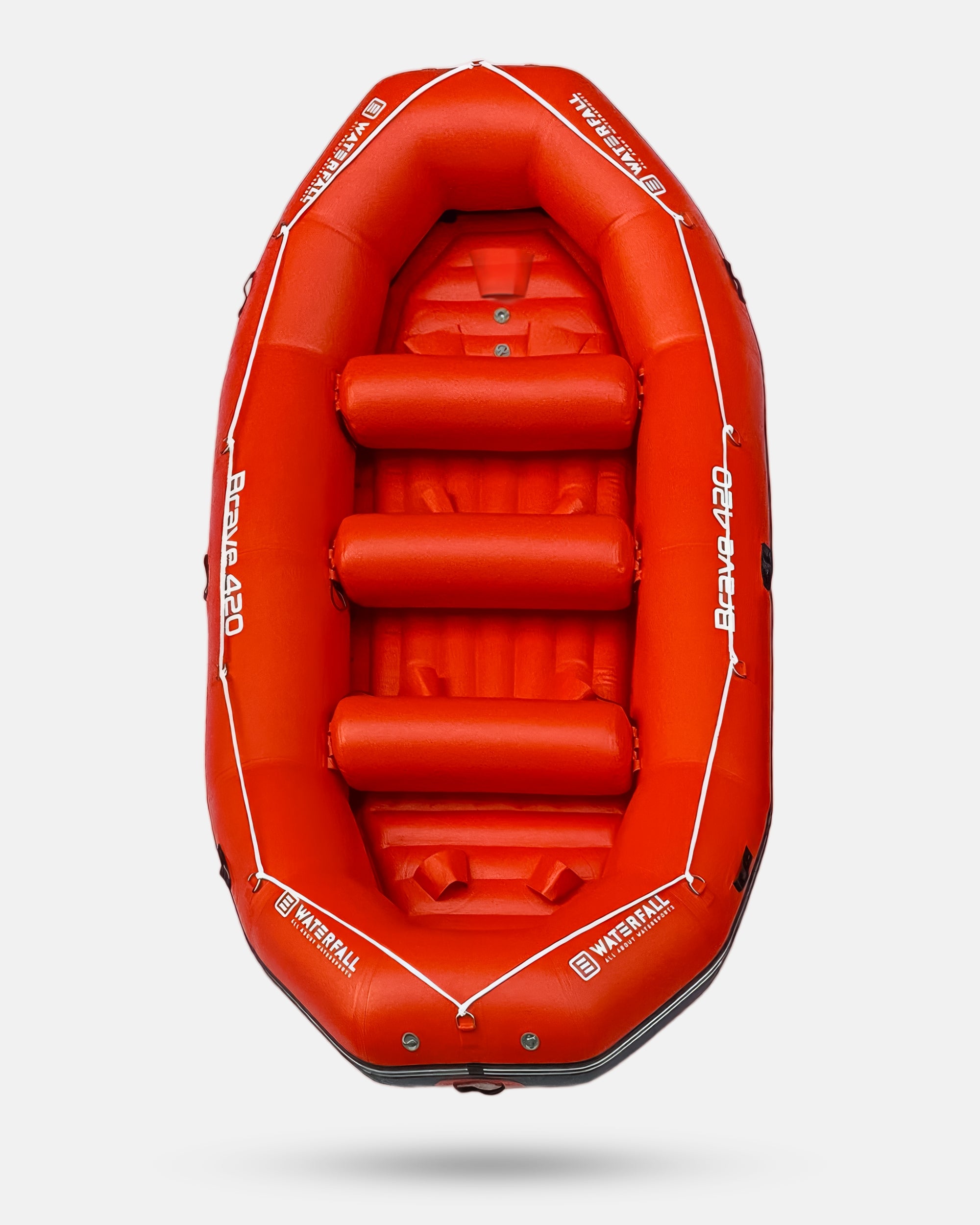 Red inflatable raft interior with padded seats and raised floor panels