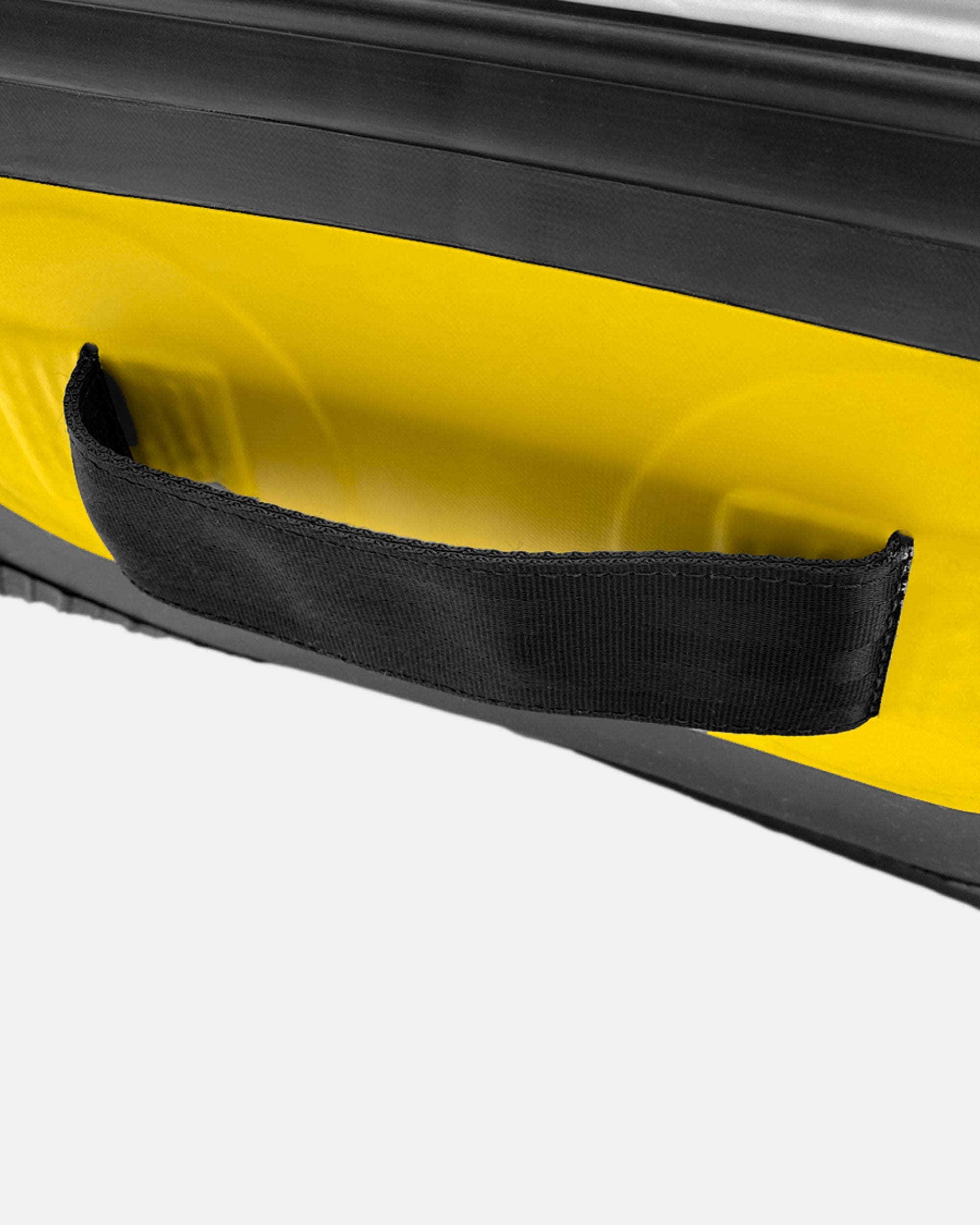 Yellow inflatable raft edge with black fabric carry strap